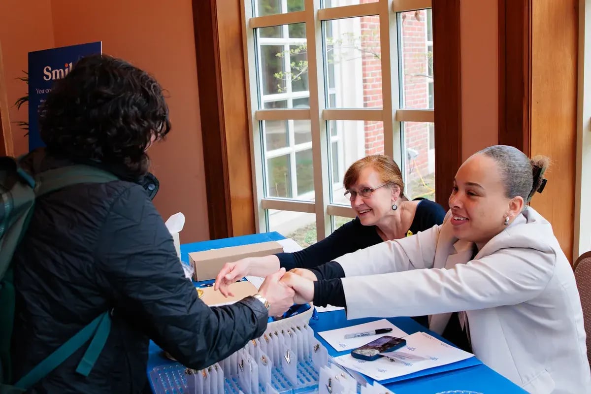 Multiple generations of professionals collaborating at a CJP event.